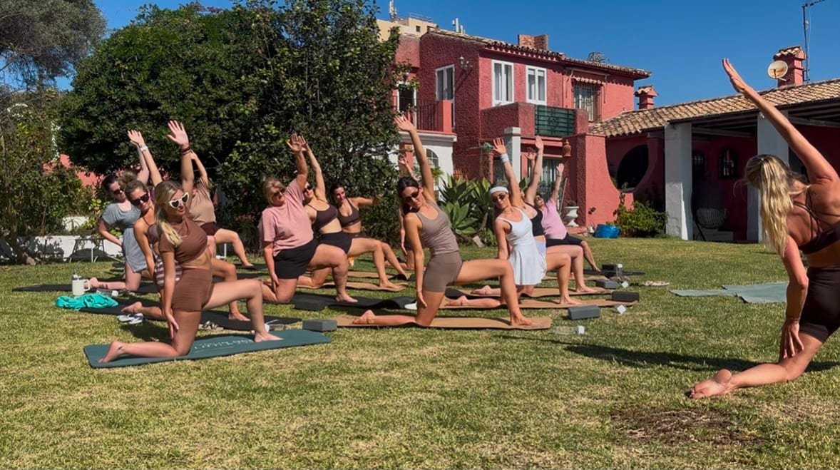 Group fitness class on a villa lawn in Marbella
