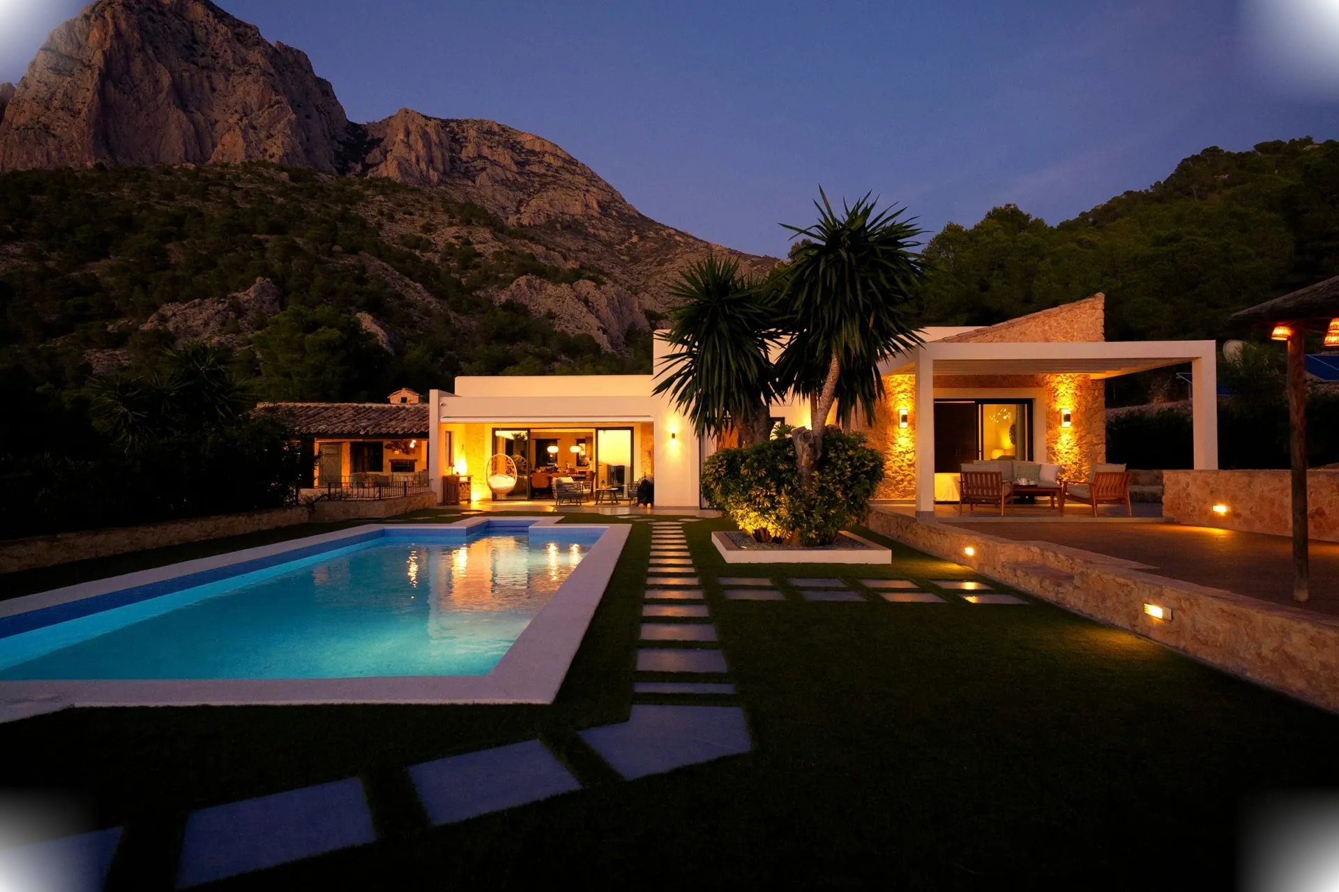 Private villa terrace and pool at dusk in Marbella